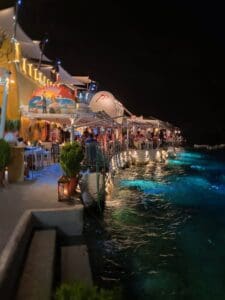A property with colorful lights and a pool
